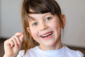 kid losing teeth